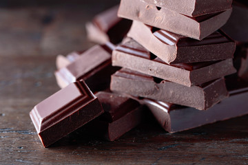 Broken black chocolate pieces.