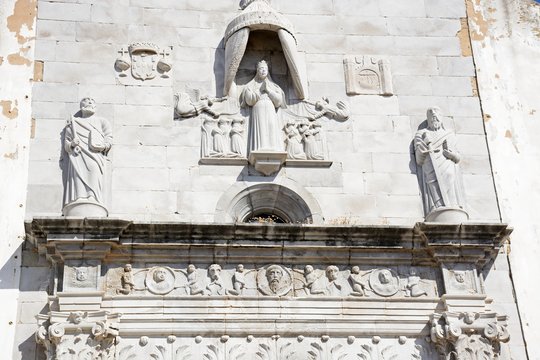 Religious sculptures on the front of the Misericordia church (Igreja da Misericordia), Tavira, Algarve, Portugal.