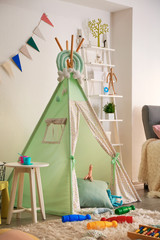 Cozy play tent for kids in interior of room © Pixel-Shot