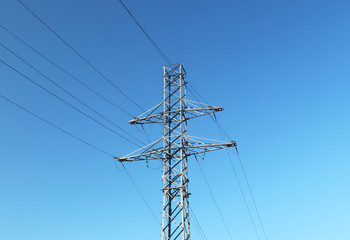 Electrical network of high voltage. Transportation of electricity through the high-voltage line. Metal tower with wires and cables. Clean country energy. Energy security. Work at height. Training matt
