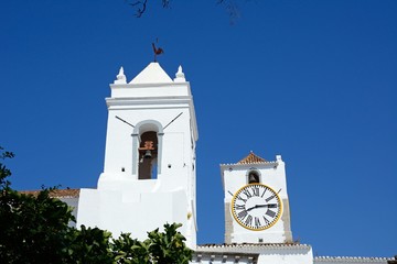 View of Santa Maria do Castelo church (Igreja de Santa Maria do Castelo) bell and clock towers,...