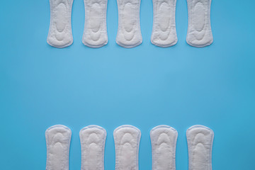 Menstrual pads on color background, top view