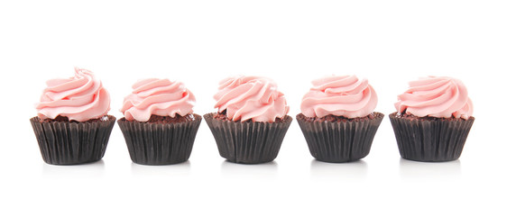 Sweet cupcakes on white background