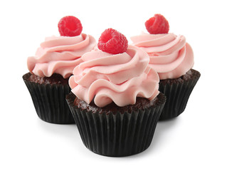Delicious cupcakes on white background