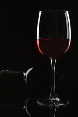 Glass of red wine on dark background