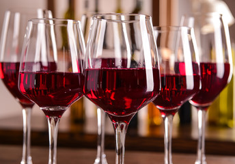 Glasses of red wine on table, closeup