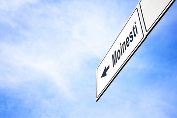 Signboard pointing towards Moinesti