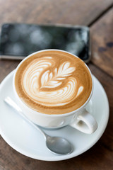 A cup of coffee with love latte art