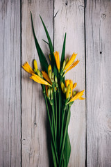 bouquet of yellow lilies on a wooden background, wedding bouquet