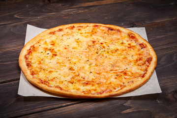pizza on the wooden background
