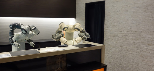 smart hotel in hospitality industry 4.0  concept, the receptionist robot (robot assistant ) in lobby of hotel or airports always welcome customer the service is  including room, information provision