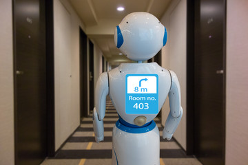 smart hotel in hospitality industry 4.0 technology concept, robot butler (robot assistant) use for...