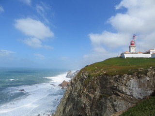 Fototapeta na wymiar lighthouse on a high rock in the ocean