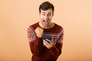 Portrait an excited young man standing