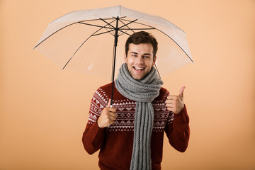 Portrait a happy young man dressed in sweater