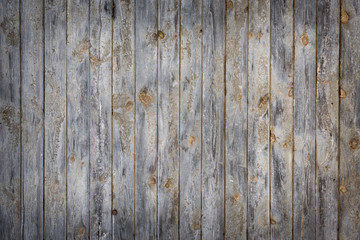 Eine Holzwand mit leichter Vignette als Hintergrund