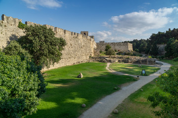 Fototapeta na wymiar Park in front of the old city wall, Rhodes Greece