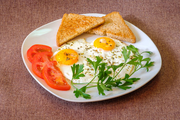 breakfast on plate, fried eggs with vegetables