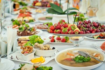delicious dishes on the table in the restaurant. serving table. sharpness in the middle of the table