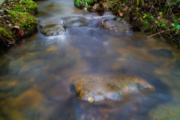 Fresh Water Rolling Over Rocks And Stone In A Long Exposure