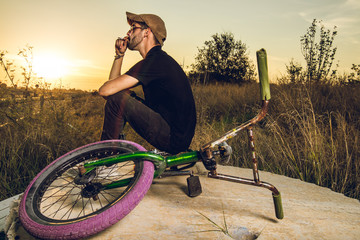 Young with bmx bike rider.Urban street sport concept