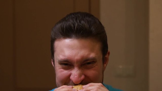 Man eating burger. Fast food. Junk food. Hamburger. Man eats a hamburger
