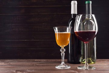 Wine bottle and grape on wooden table