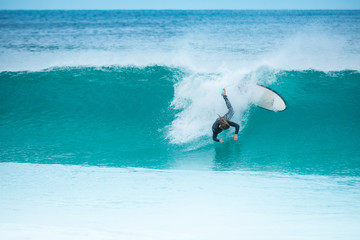 surfer falling into water