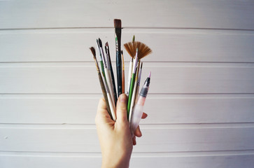 hand with paint brush