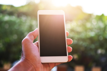 Hand holding smart phone ,mobile phone technology internet online business marketing communication connection mobile app background wireless