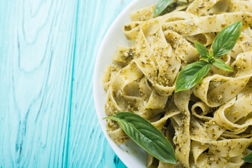 Pasta tagliatelle with green sauce pesto