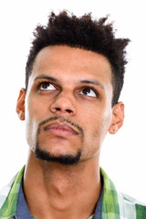 Obraz premium Face of young African man thinking while looking up