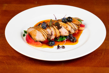 Baked duck breast with peach