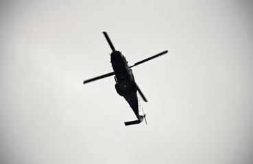 Helicopter flying over the sky