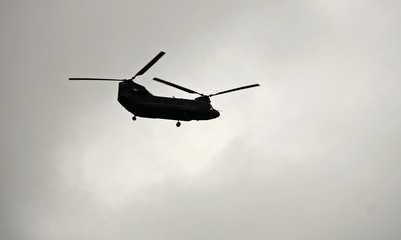 Fototapeta na wymiar Helicopter flying over the sky
