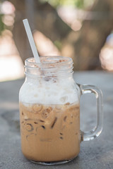 Iced coffee with milk in mason jars