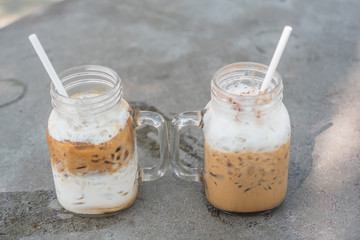 Iced coffee with milk in mason jars