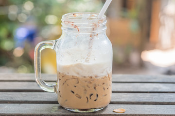 Iced coffee with milk in mason jars