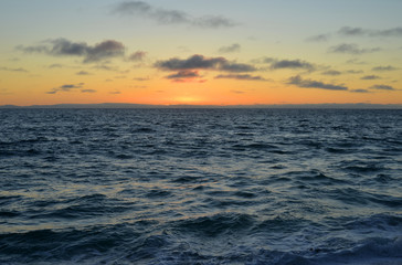 Fototapeta na wymiar Sunset at the pacific ocean in california