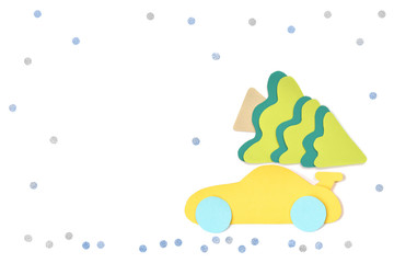 Car with christmas tree paper cut on white background - isolated