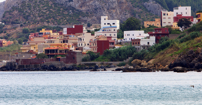 panoramic view of beach and old houses, Belyounech Morocco