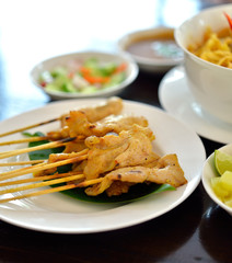 Grilled pork satay with peanut sauce , Thai food