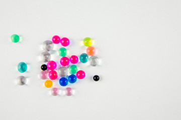 Water crystal gel or water beads is any gel which contains a large amount of water. Different color gel balls isolated on white background. 