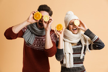 Portrait of a cheerful young couple dressed in sweaters