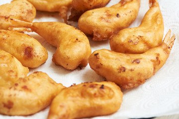 A plate of delicious fried prawn balls with sauce on the table