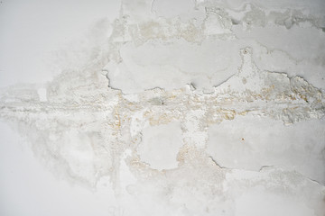 White wall fragment with scratches and cracks, grunge texture