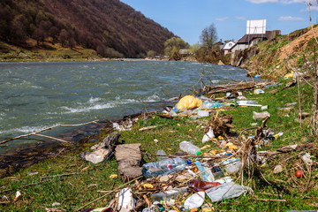different garbage on the riverbank