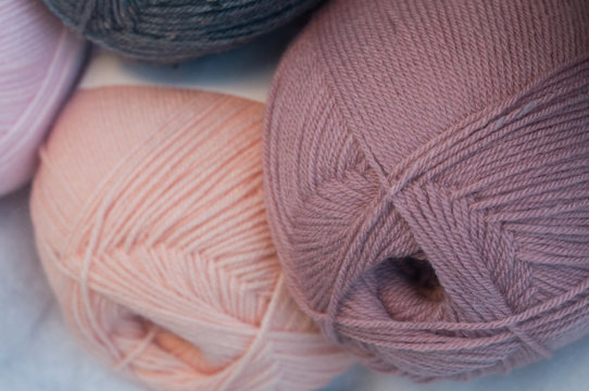 closeup of pink and purple  wool balls in  in fashion store