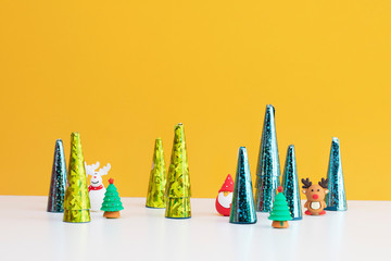 Cute christmas ornaments on yellow background