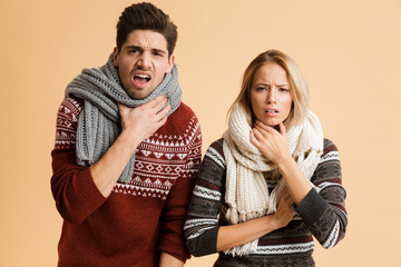 Portrait of a frozen young couple dressed in sweaters